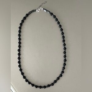 Handmade volvanic stone necklace, hematite stainless steel clasp one size.